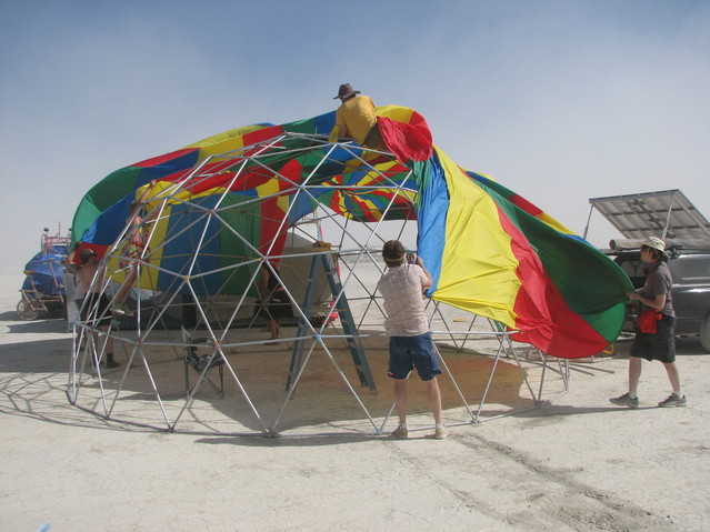 img_9071.jpg: At Circus Boot Camp: First attempt to get the chute over the dome. The heavy wind makes it difficult.